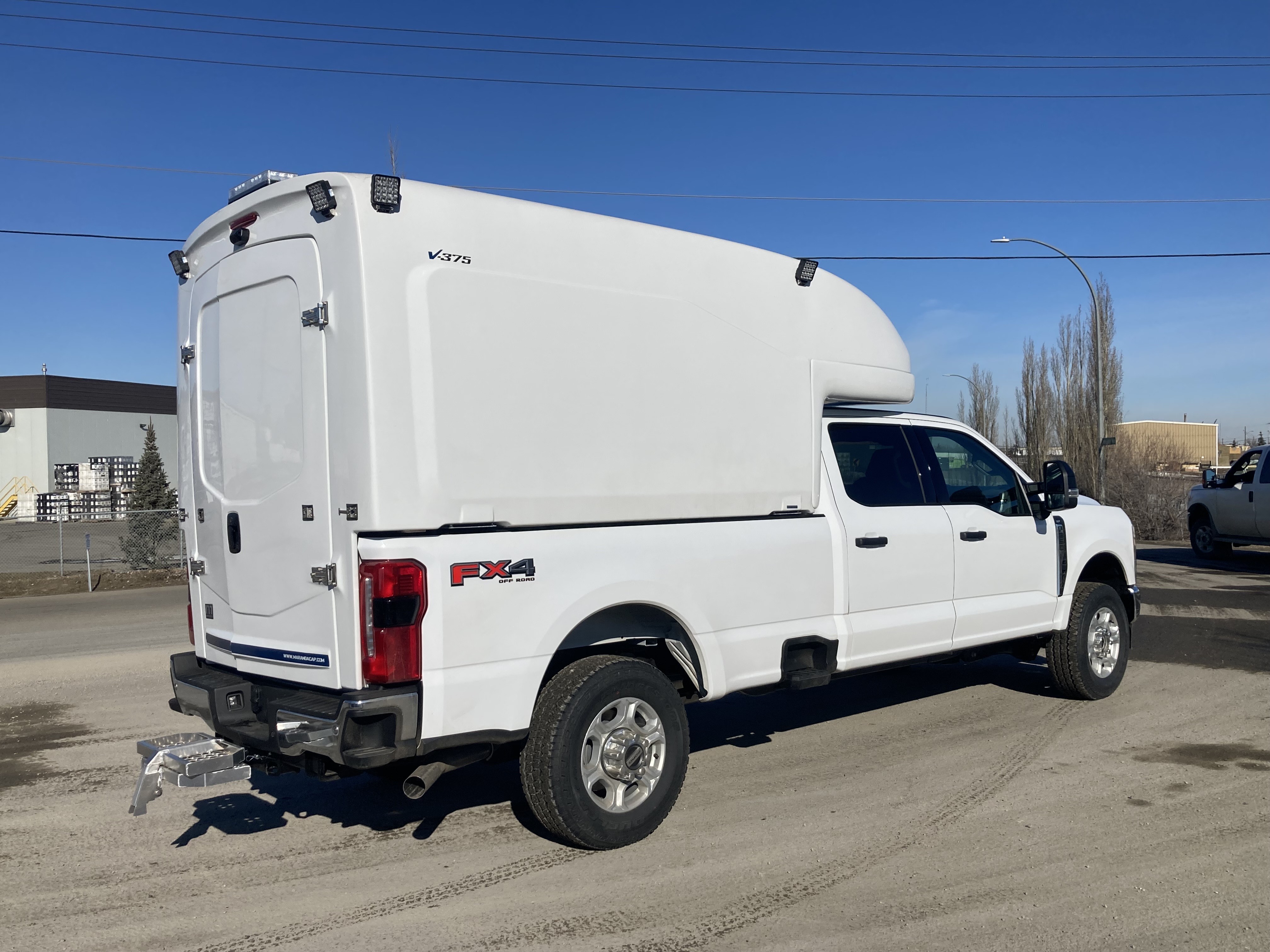 Maranda slip-in body side view installed on a pickup truck