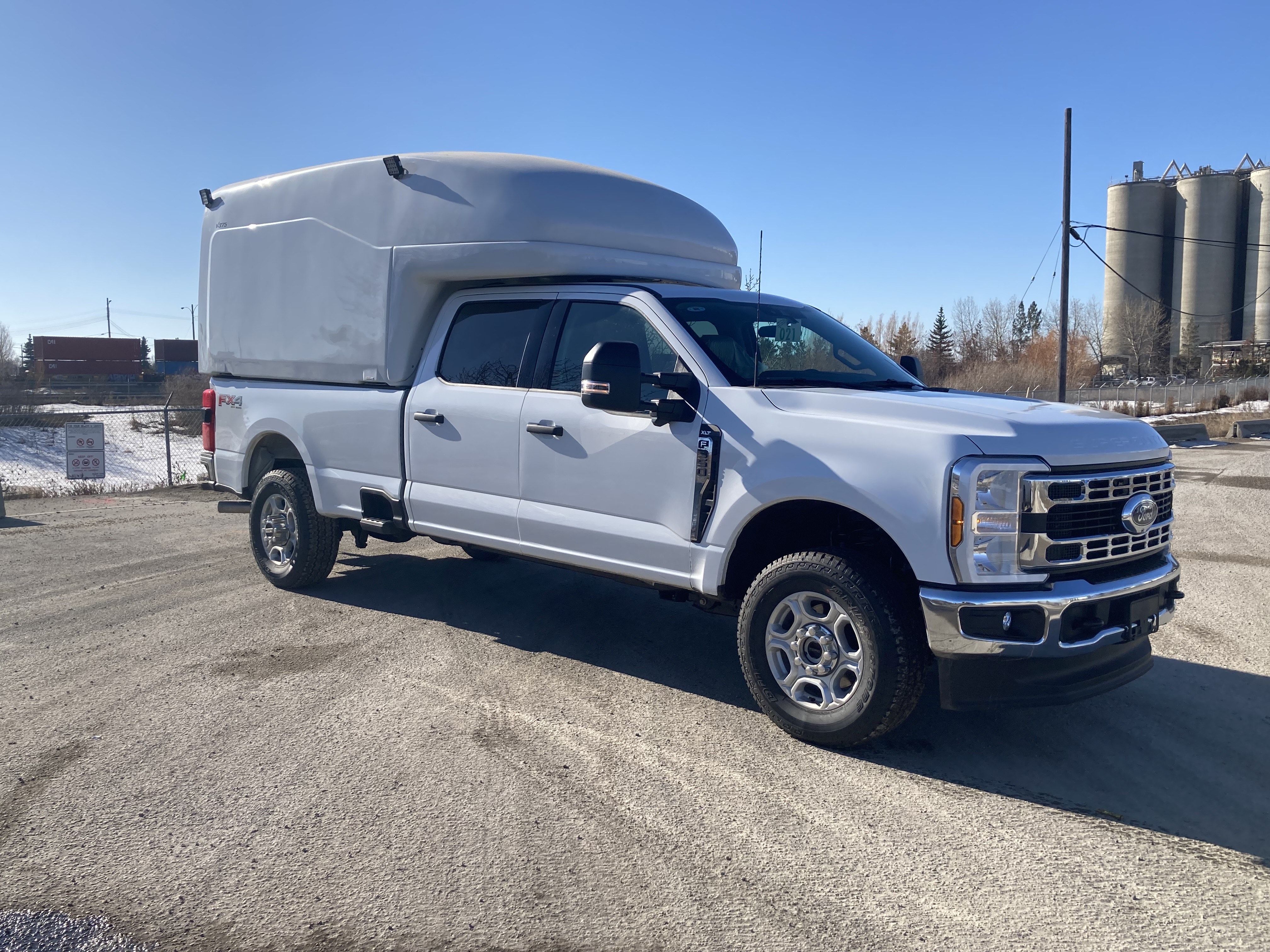 Maranda slip-in body installed on a white pickup truck